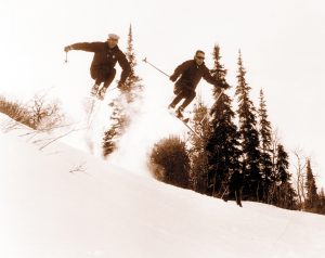 Butch Hoffman and Earl Miller airborn off of School Hill and Snowbasin