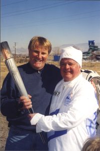 Leif Grevle (Solitude’s ski school director) and Gary DeSeelhorst at the 2002 Olympic torch relay in southern Utah.