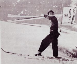 Sverre carrying snow safety sign